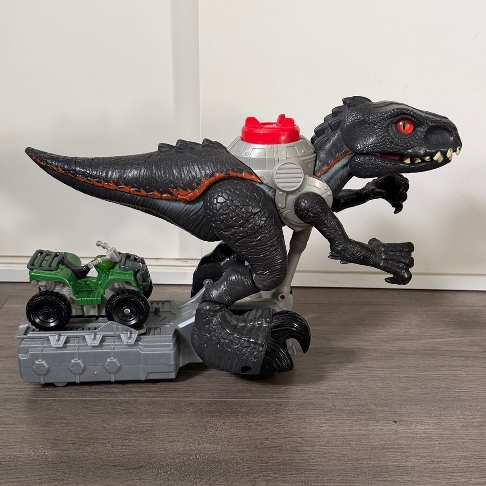Ferocious Black Dinosaur Toy with Green Vehicle